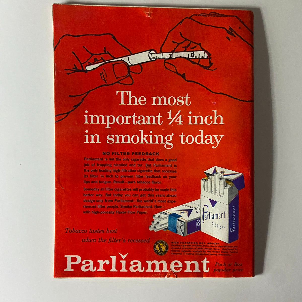 Back cover advertisement for Parliament cigarettes, highlighting the importance of the filter design with a hand holding a measurement tool, emphasizing 'The most important ¼ inch in smoking today.'