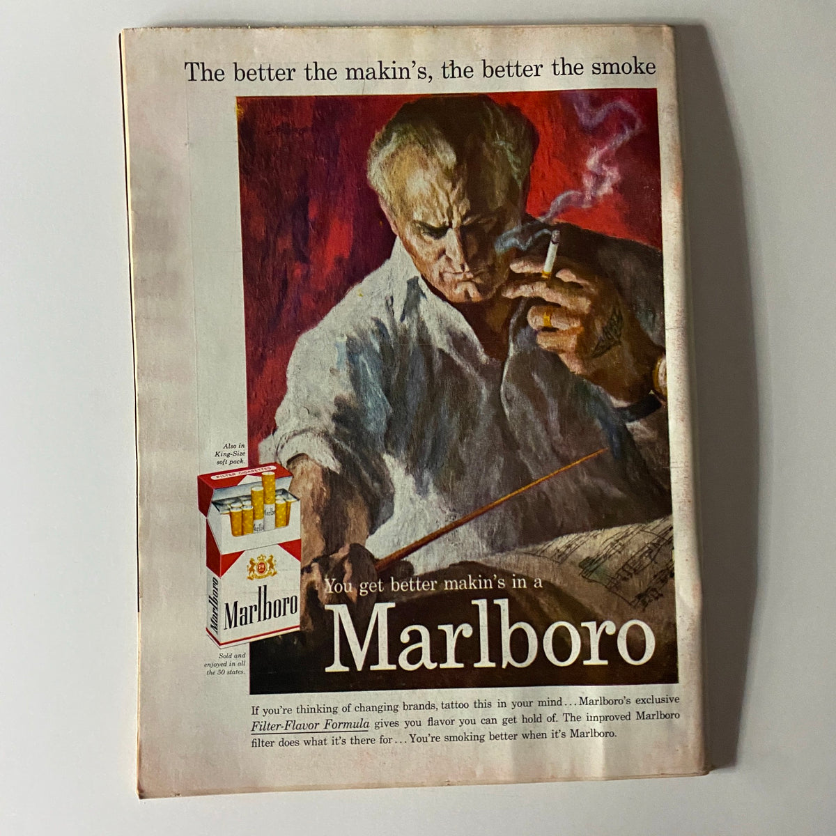 Vintage Marlboro advertisement with a man smoking, emphasizing the slogan 'You get better makin’s in a Marlboro', highlighting mid-20th century advertising aesthetics.