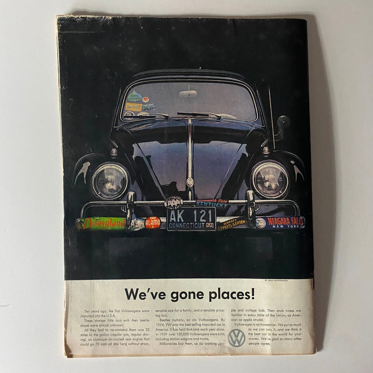 Back cover of Time Magazine from December 28, 1959, Vol 74 No. 26 featuring a classic Volkswagen car with various travel stickers, reflecting mid-20th-century Americana.