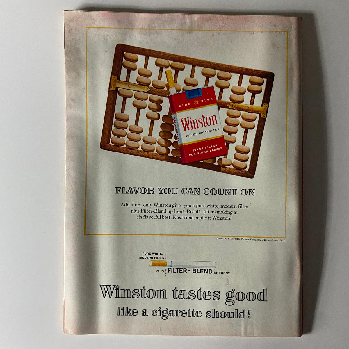 Vintage advertisement for Winston cigarettes in Time Magazine November 15, 1963, promoting the brand's modern filter and flavor, reflecting the advertising style of the era.