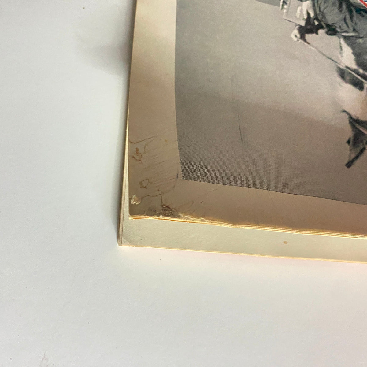 Close-up of the corner of Time Magazine November 14, 1955, showing minor wear and tear, indicating its age as a collectible vintage publication.