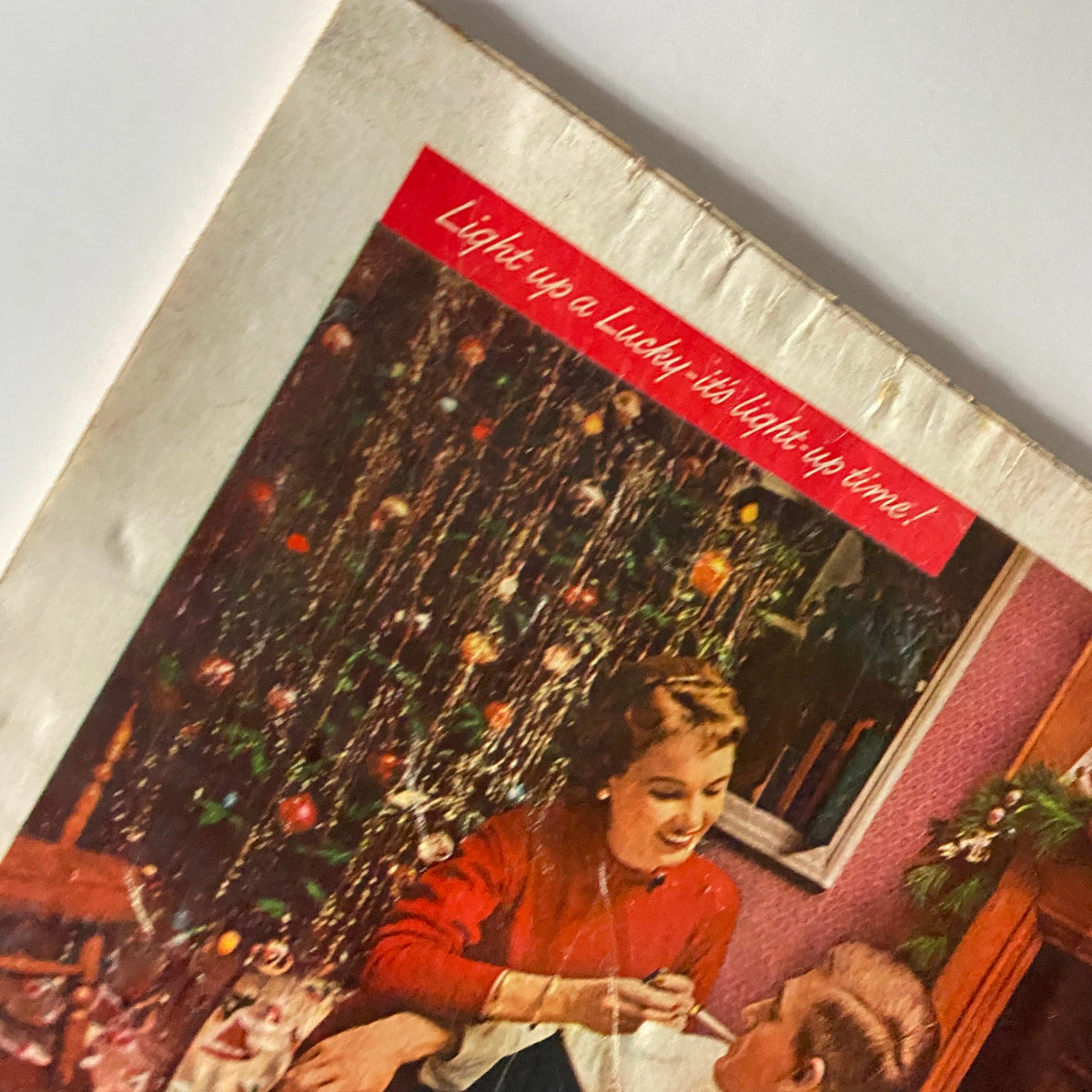 Close-up of the Time Magazine December 12, 1955, Vol 66 No. 24 cover highlighting the message 'Light up a Lucky, it's light-up time!' over a Christmas-themed background.