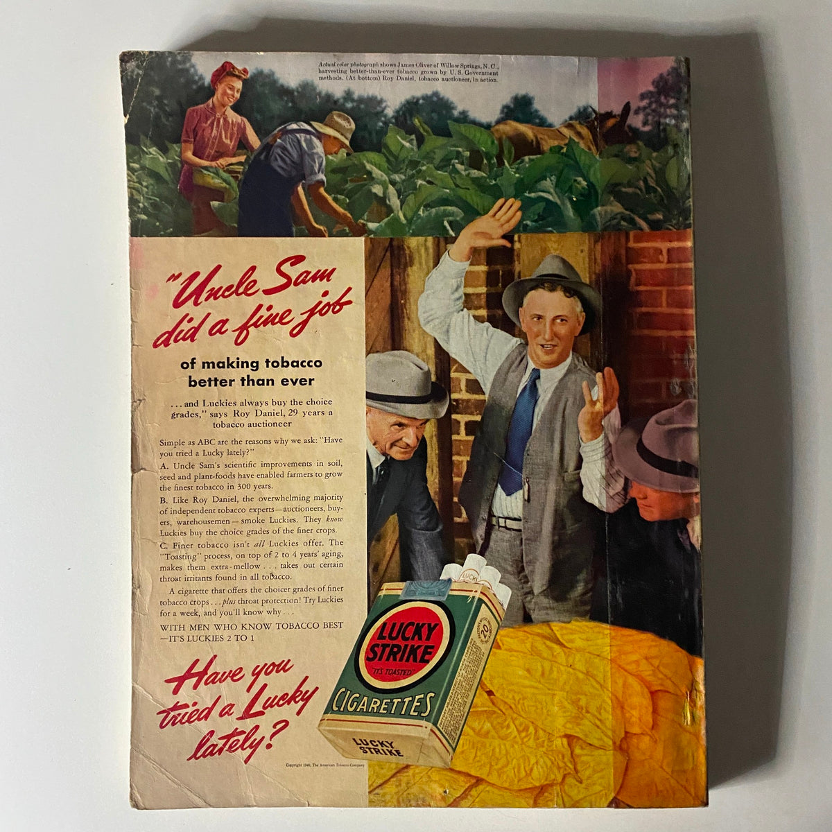 Back cover of Mademoiselle Magazine May 1940 featuring a vintage advertisement for Lucky Strike cigarettes, illustrating farmers in a tobacco field, highlighting the era's agricultural themes.