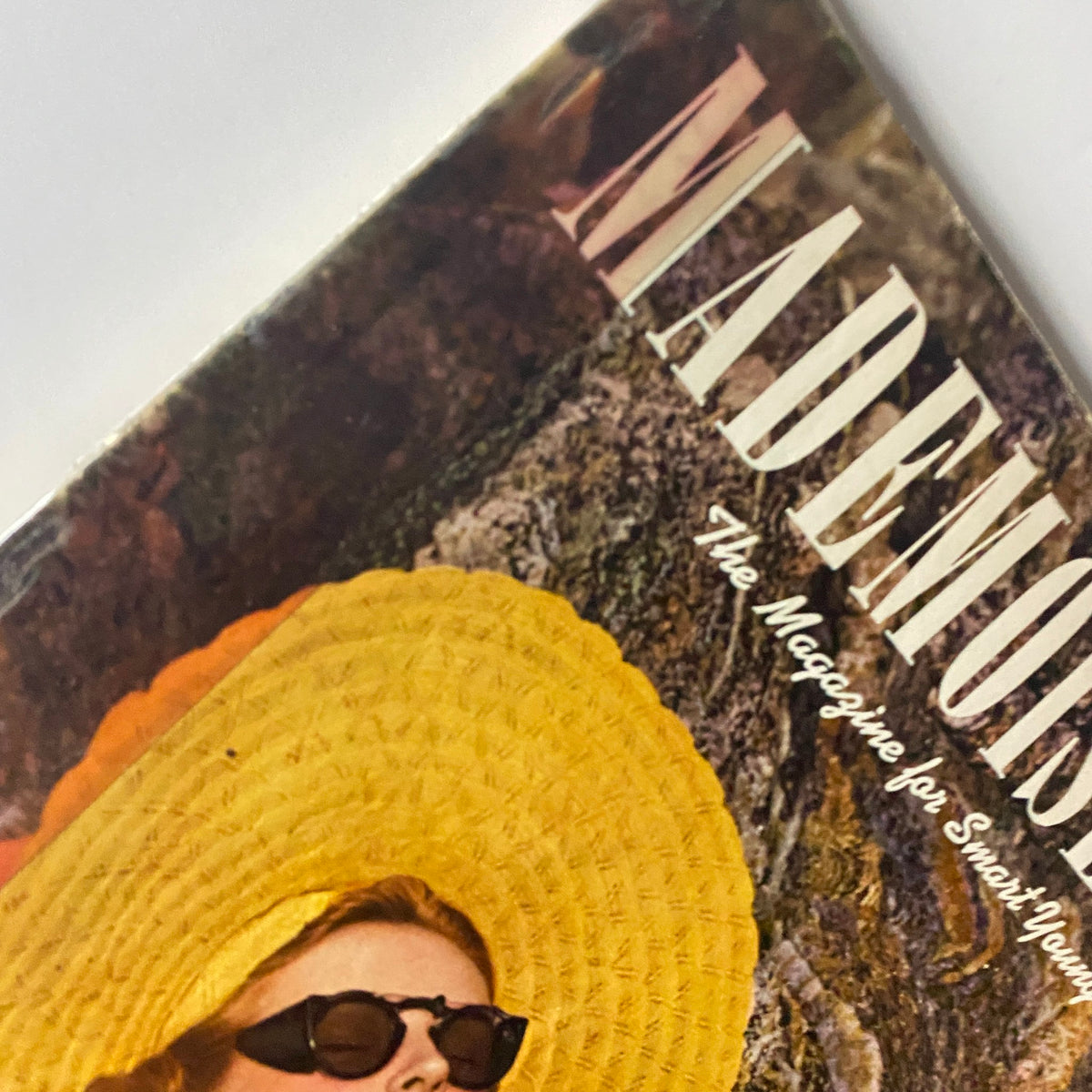 Close-up of the cover of Mademoiselle Magazine June 1940 Vacation Special, highlighting the vibrant sunhat and elegant design details of the magazine.