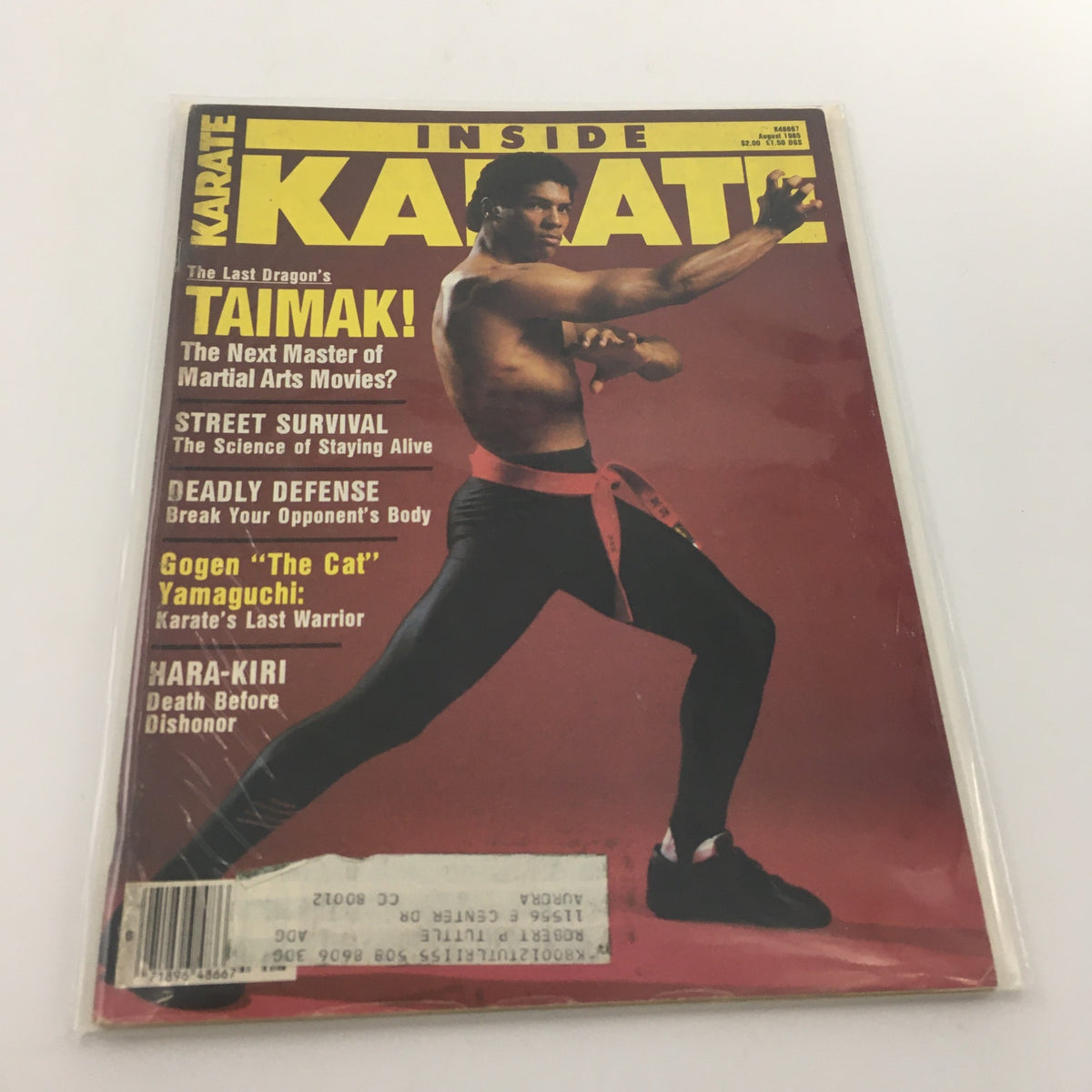 Inside Karate Magazine August 1985 featuring Gogen "The Cat" Yamaguchi on the cover, showcasing martial arts themes and techniques.