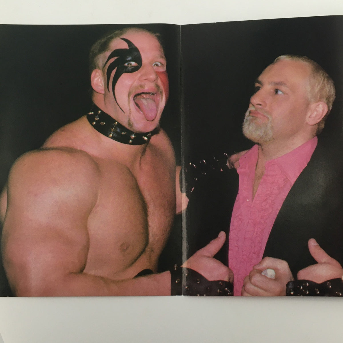 A striking image from Wrestling Scene Magazine July 1985 Issue #23 showcasing a wrestler with face paint and a collar alongside another wrestler in a pink shirt.