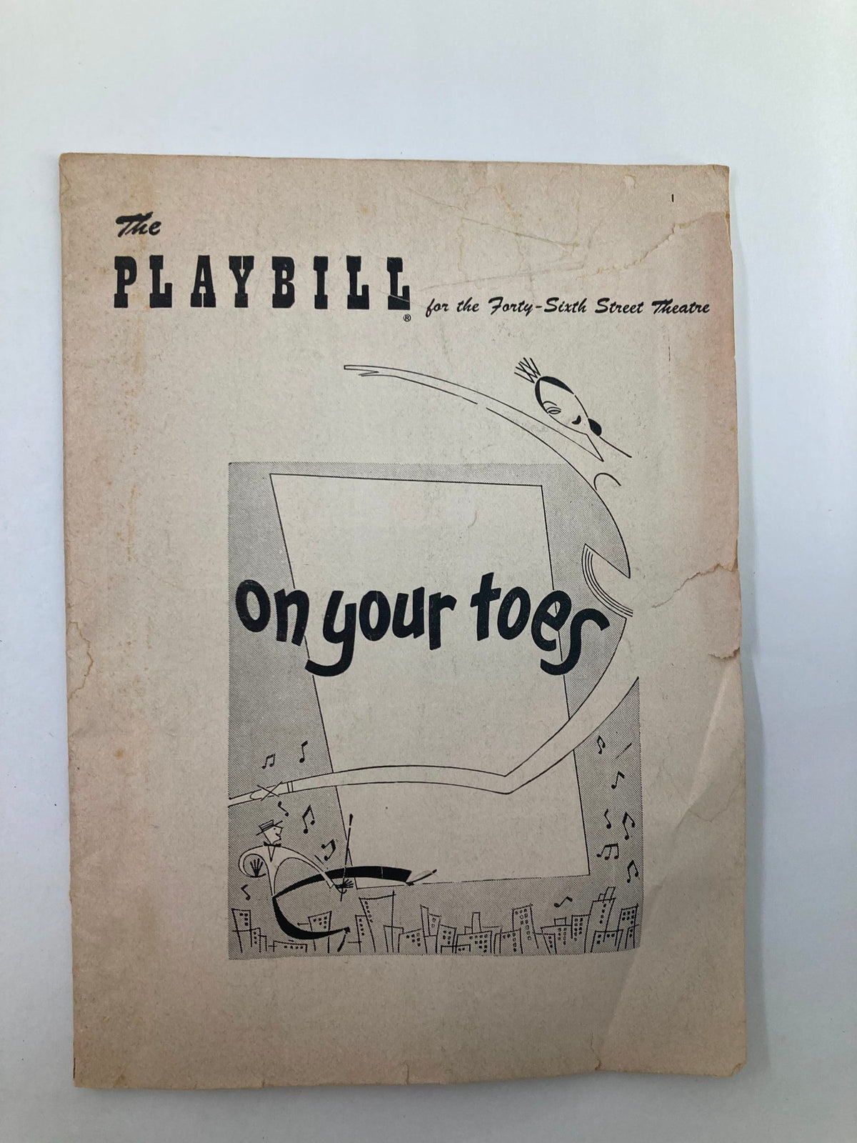 1954 Playbill for the Forty-Sixth Street Theatre featuring the musical 'On Your Toes', showcasing vintage design and iconic theatrical elements.