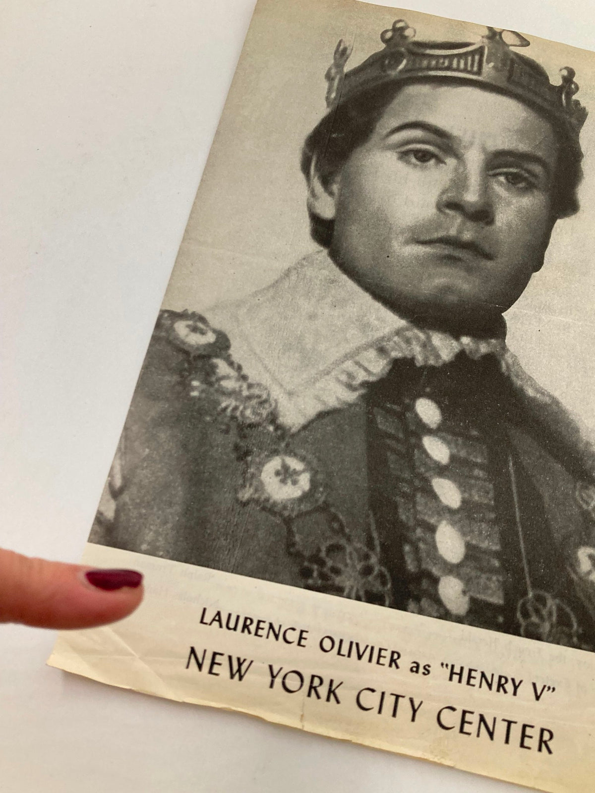 Close-up of the 1947 Program from New York City Center, highlighting Laurence Olivier as Henry V, with emphasis on the title text and actor's portrait.