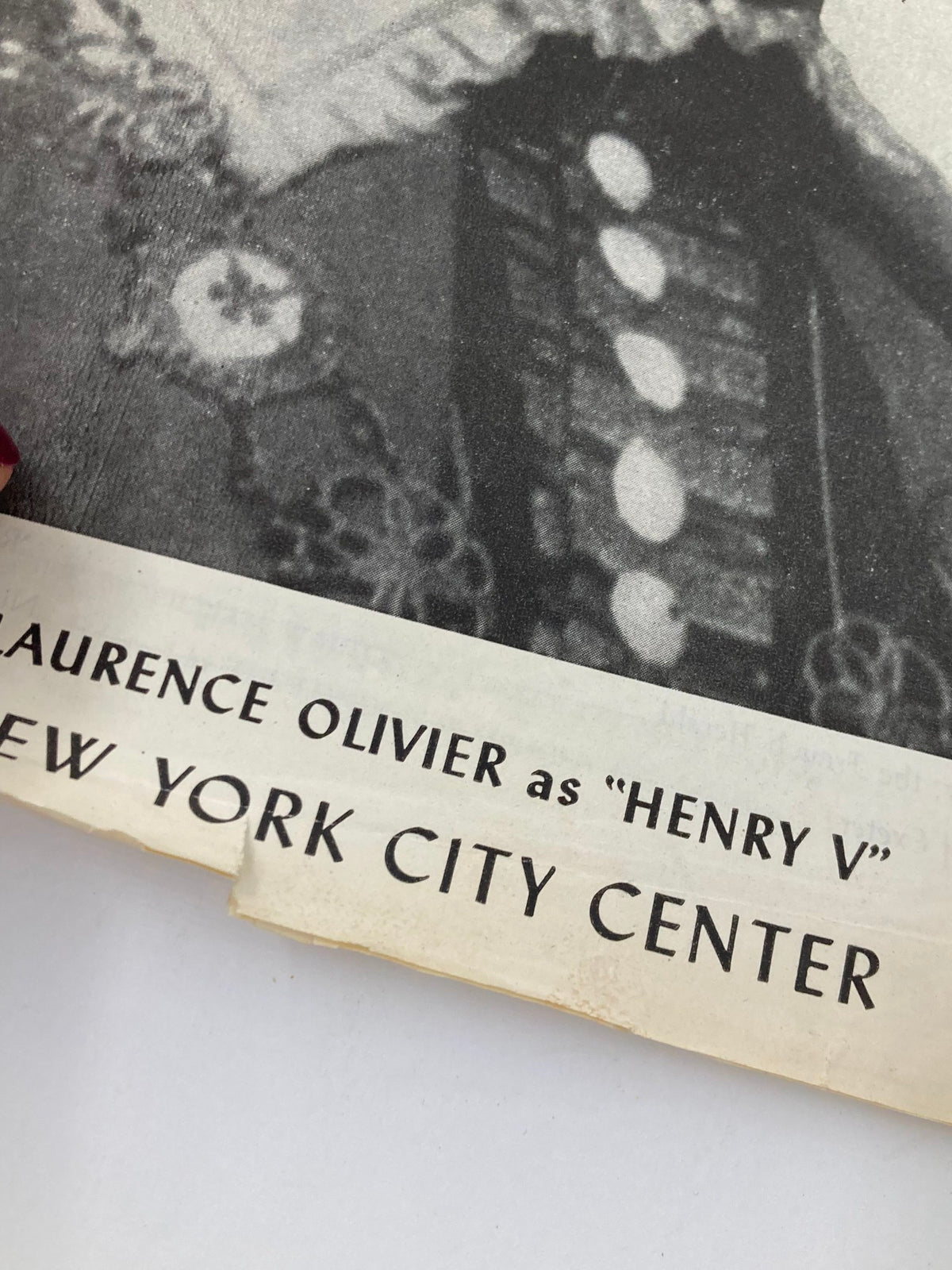Detailed view of the 1947 Program for Henry V at New York City Center, showing the lower section featuring Laurence Olivier's name in bold.