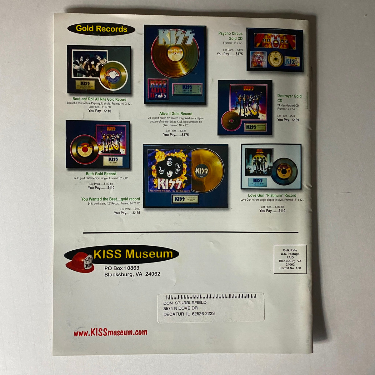 Back cover of the KISS Museum.com Catalog Christmas and New Year's 2000, featuring gold records and promotional details related to the KISS band.