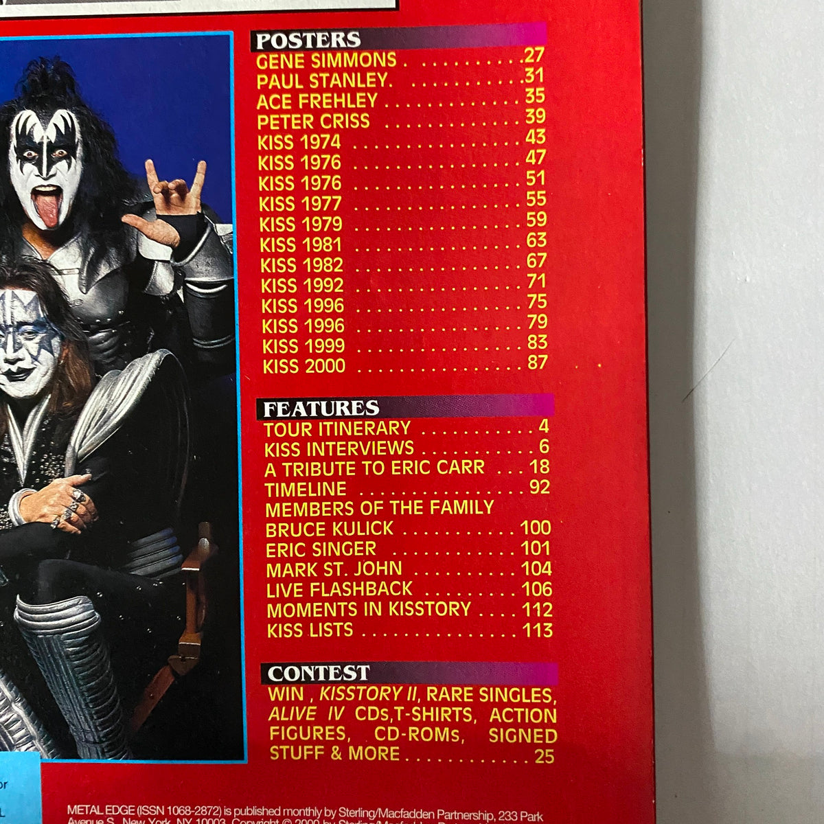 Inside page of KISS Farewell Poster Book Metal Edge Special 2000, showcasing a detailed content list including featured interviews, tributes, and timeline of iconic moments in KISS history.