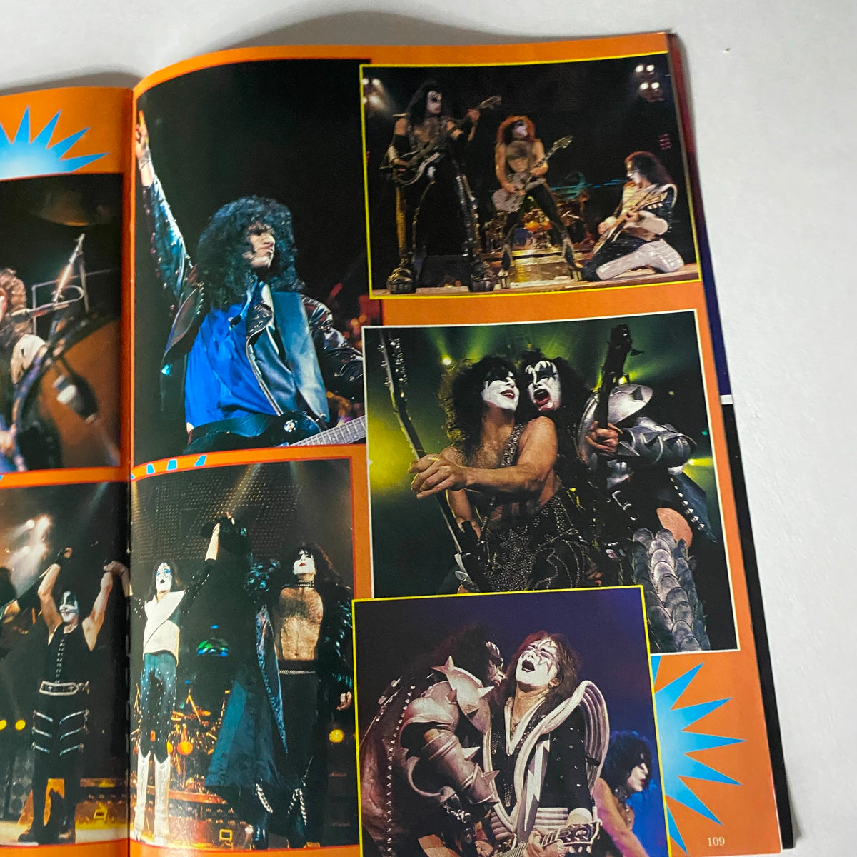 Action shots of KISS during a live performance included in KISS Farewell Poster Book: Metal Edge Special 2000.