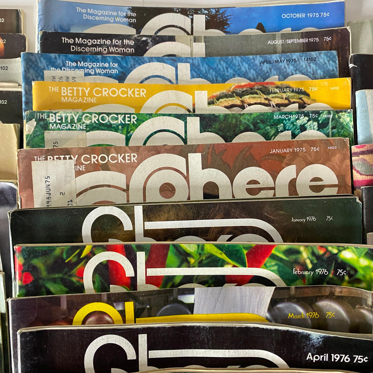 Stack of Betty Crocker Sphere magazines from the 1970s and 1976, highlighting various culinary themes and vintage advertisements. A captivating find for collectors of vintage magazines.