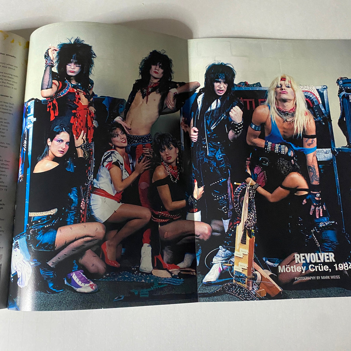 Spread from Revolver Magazine April 2005 displaying Mötley Crüe along with an iconic 1980s style, capturing the essence of glam metal culture.