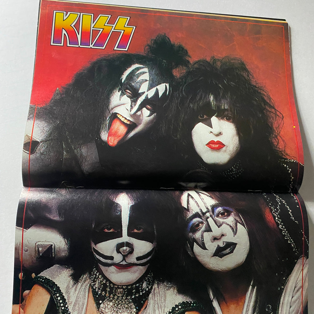 Fold-out poster page featuring KISS, from Hit Parader Magazine November 1998, celebrating the band's vibrant rock history.