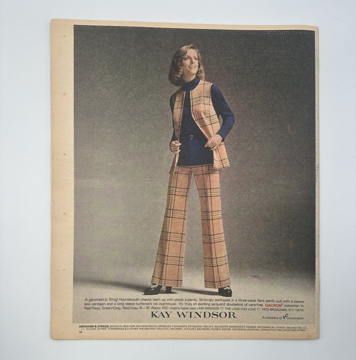 Fashion advertisement from The New York Times Magazine, August 5, 1973, showcasing a model wearing a geometric check pattern outfit by KAY WINDSOR.