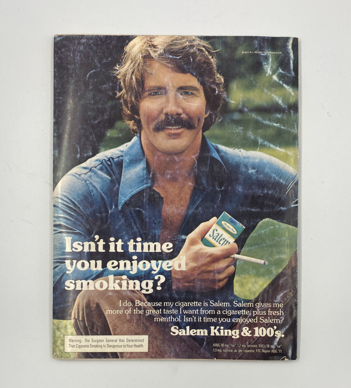 Esquire Magazine January 1978 advertisement promoting Salem cigarettes with a man holding a cigarette box, emphasizing the brand's message about enjoyment in smoking.