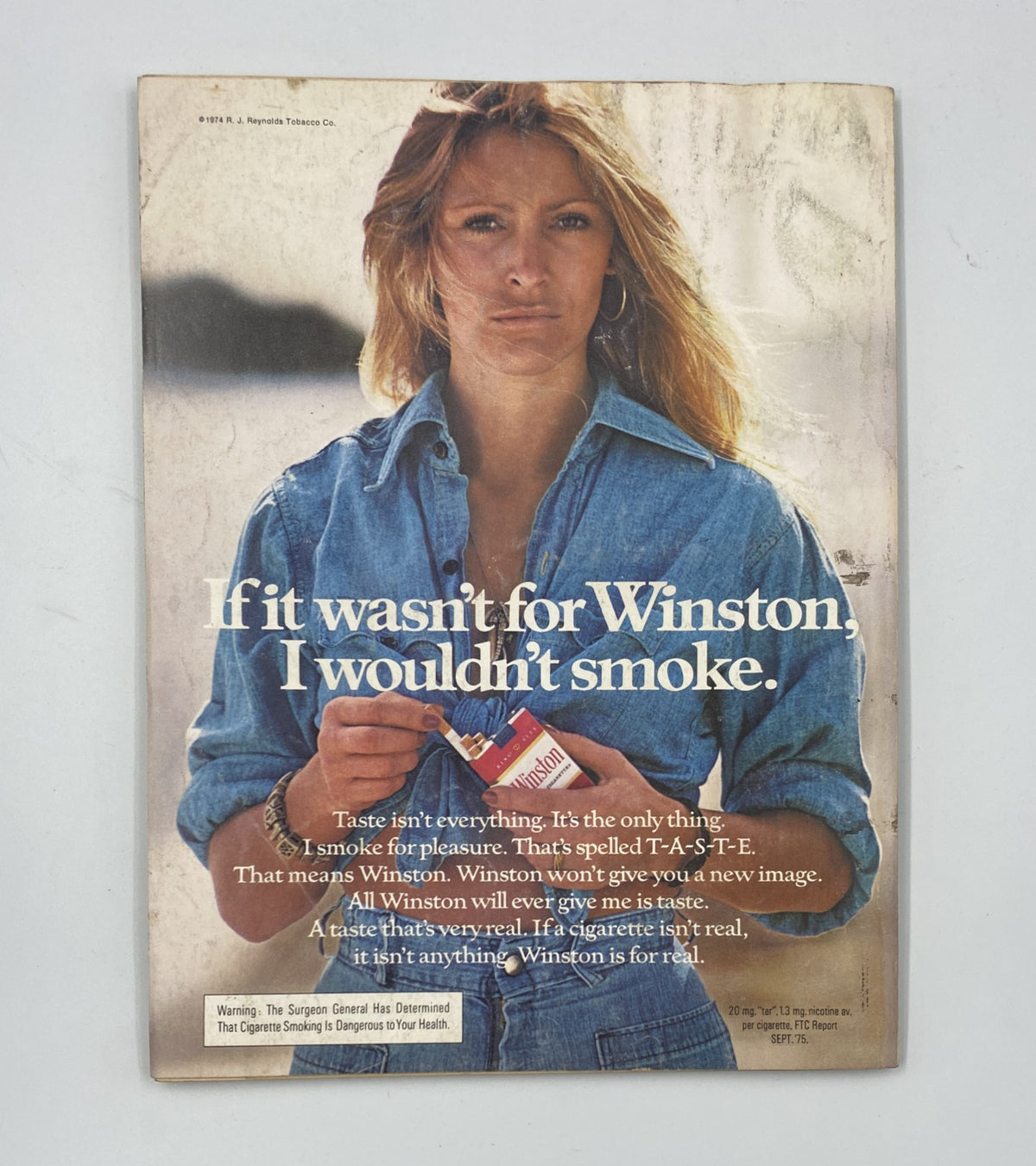 Back cover of Esquire Magazine July 1976 showcasing an advertisement with a model promoting Winston cigarettes, emphasizing 'If it wasn’t for Winston, I wouldn’t smoke'.
