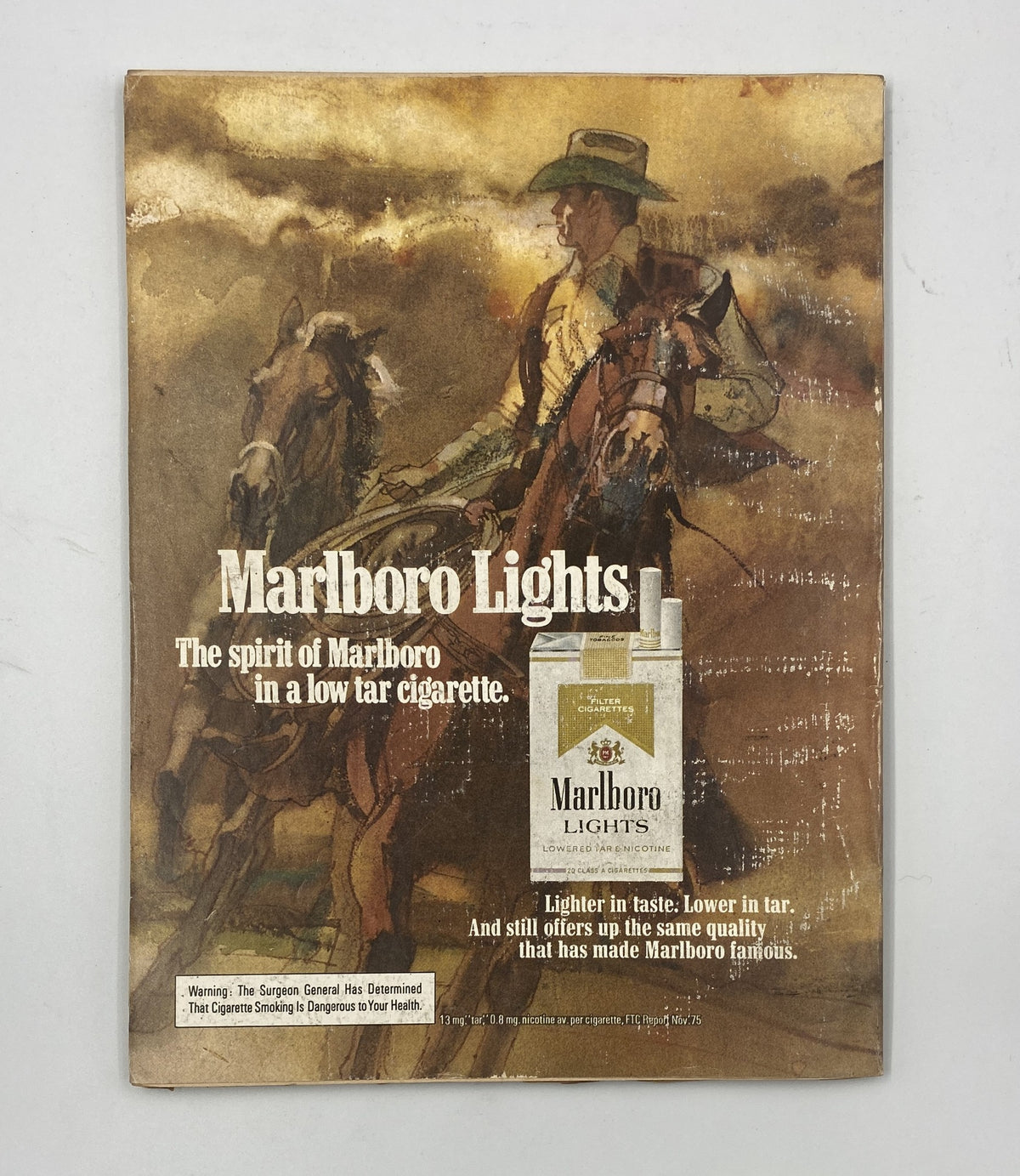 Advertisement for Marlboro Lights in Esquire Magazine June 1976 Summer Special Fashion Travel Food Party Guide showcasing a cowboy on horseback.