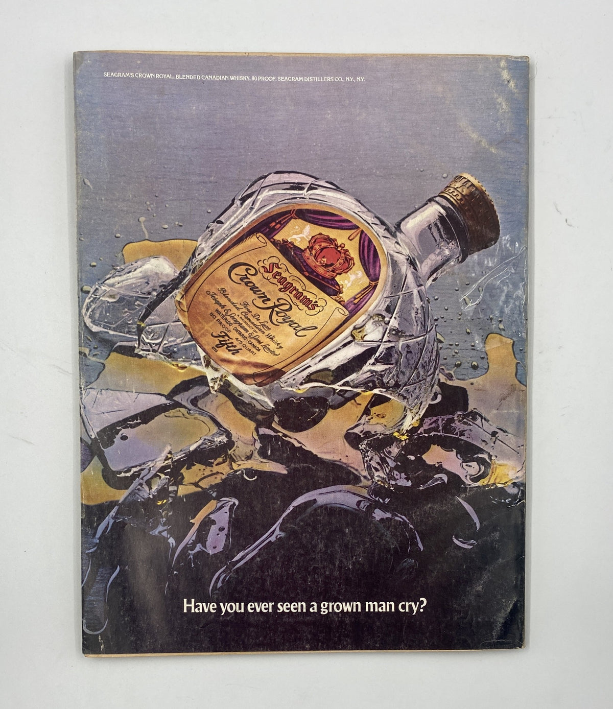 Back cover of Esquire Magazine May 1977 with an advertisement for Crown Royal whiskey featuring the slogan 'Have you ever seen a grown man cry?'. The design reflects the vintage style of the era.