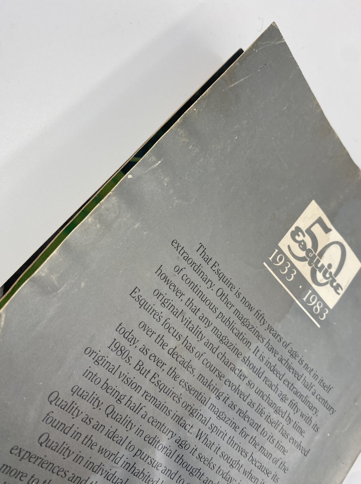 Close-up of the spine and corner of Esquire Magazine June 1983 How We Lived 1933–1983 50th Anniversary Issue, showing minor wear and damage.