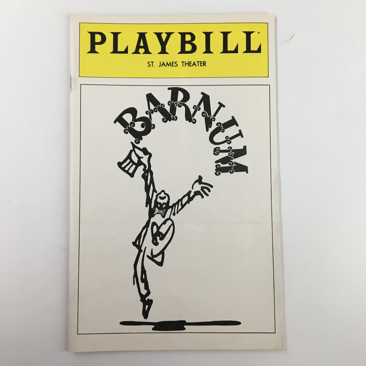 1980 Playbill for Barnum featuring a striking illustration of a performer in a top hat and tails, capturing the theatrical spirit of the St. James Theatre.