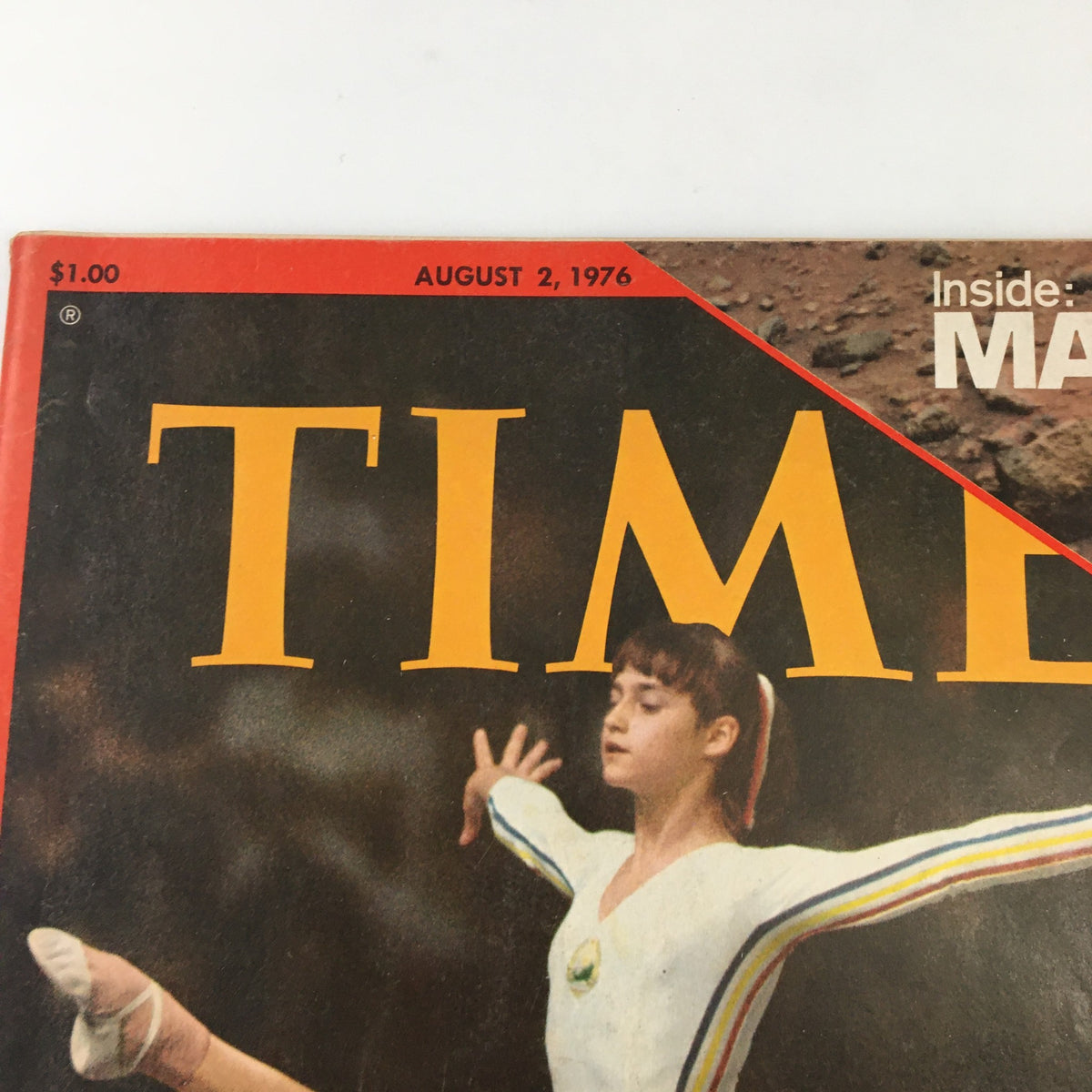 Close-up of the top section of the vintage Time Magazine from August 2, 1976, highlighting the title and date with Nadia Comaneci featured.