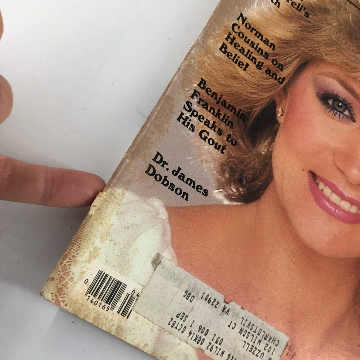 Close-up view of the spine of The Saturday Evening Post April 1982, highlighting the condition and details, featuring Barbara Mandrell on the cover. A unique collectible for enthusiasts of vintage media.