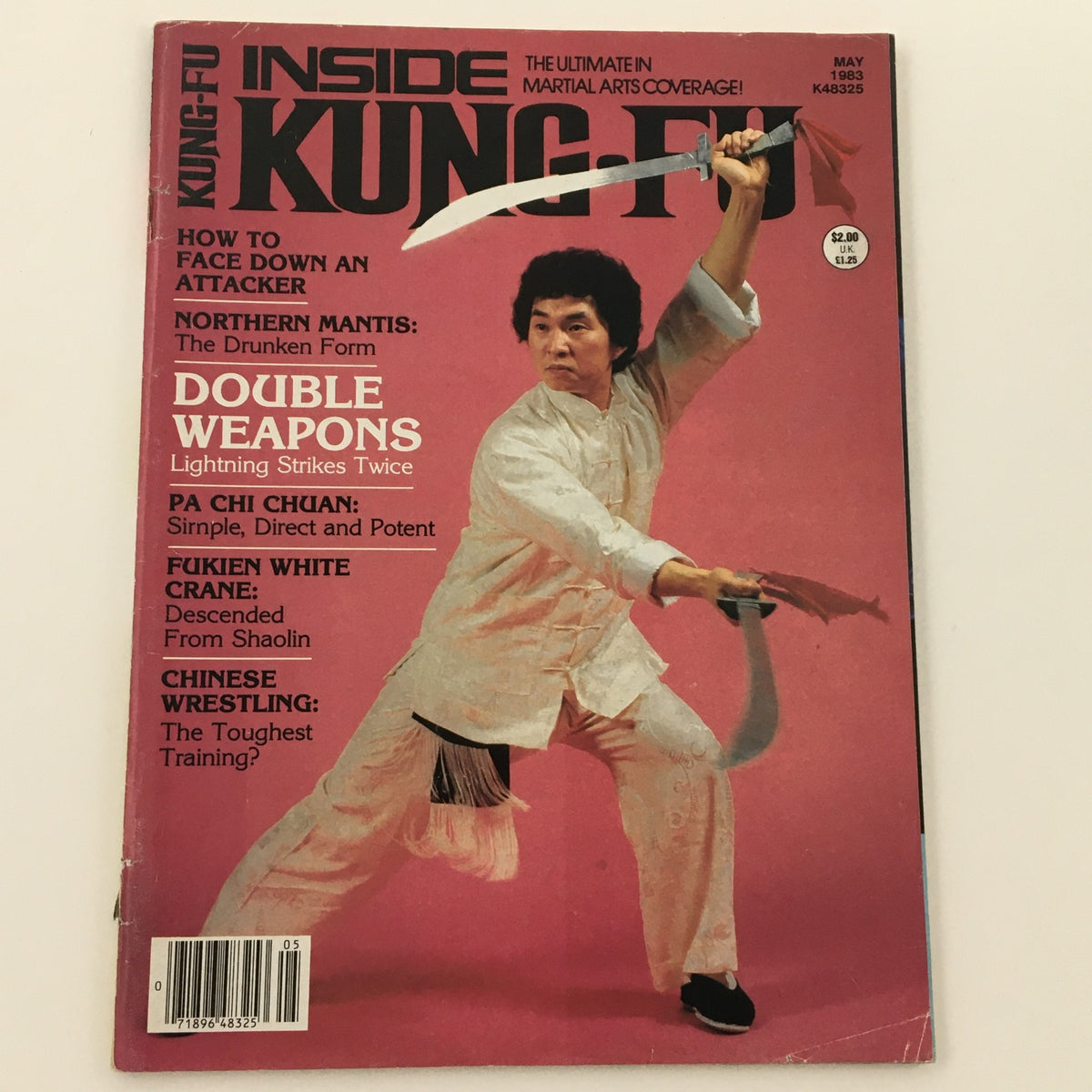 Cover of Inside Kung-Fu Magazine May 1983 highlighting 'Double Weapons Strikes Twice', with an image of a martial artist in action holding two swords.