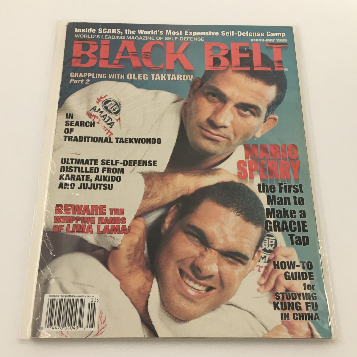 Cover of Black Belt Magazine May 1999 featuring an article on grappling with Oleg Taktarov. The magazine highlights various martial arts topics including Taekwondo, self-defense techniques from Karate and Jujutsu, and features Mario Sperry.