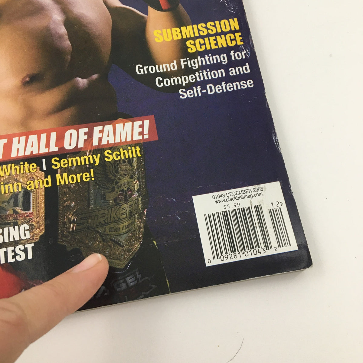 Back cover detail of Black Belt Magazine December 2008 featuring MMA Champion Cung Le, showing magazine highlights and promotional content.
