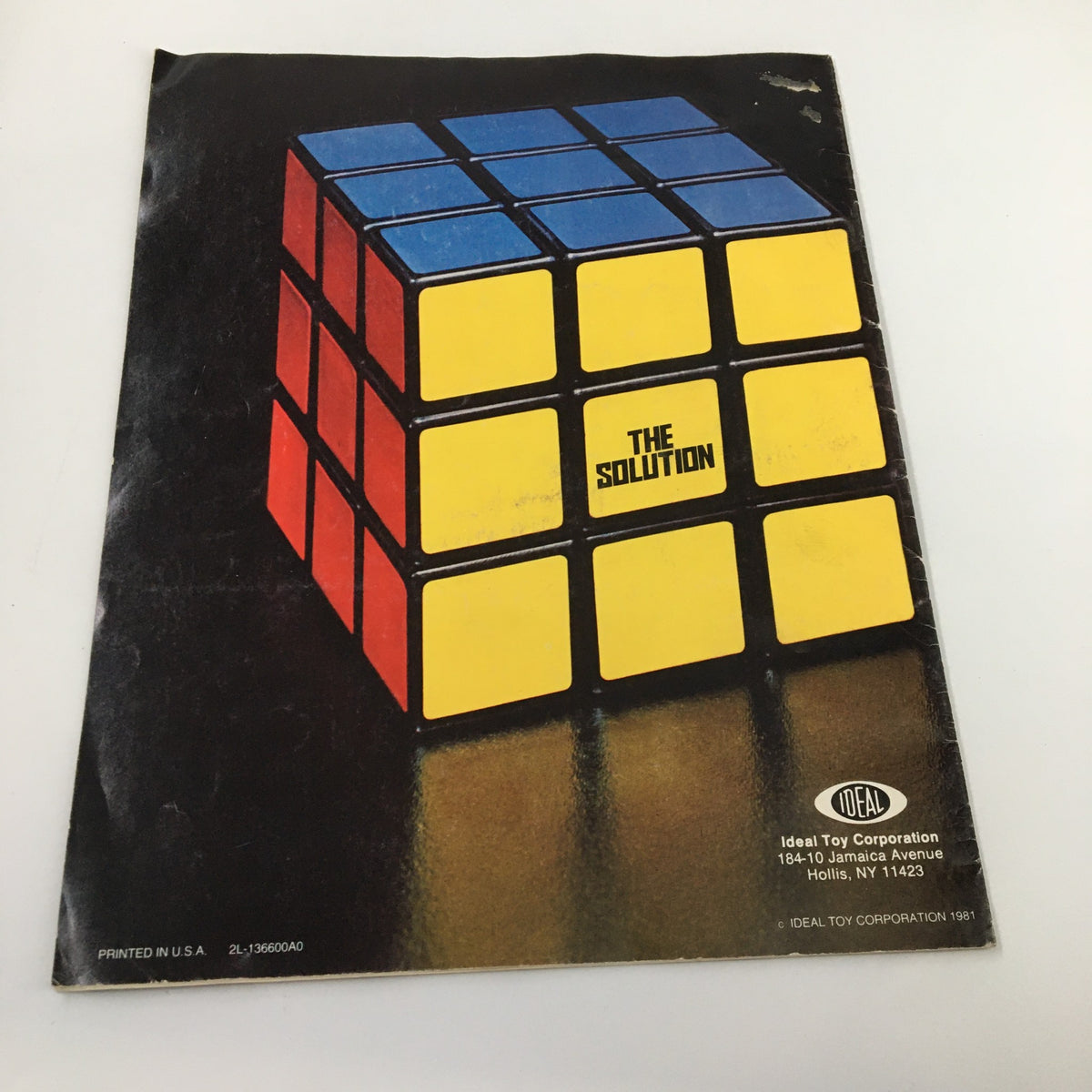Cover illustration of the '1981 Rubik's Cube: The Ideal Solution' magazine featuring a classic Rubik's Cube with the text 'THE SOLUTION' in bold letters.