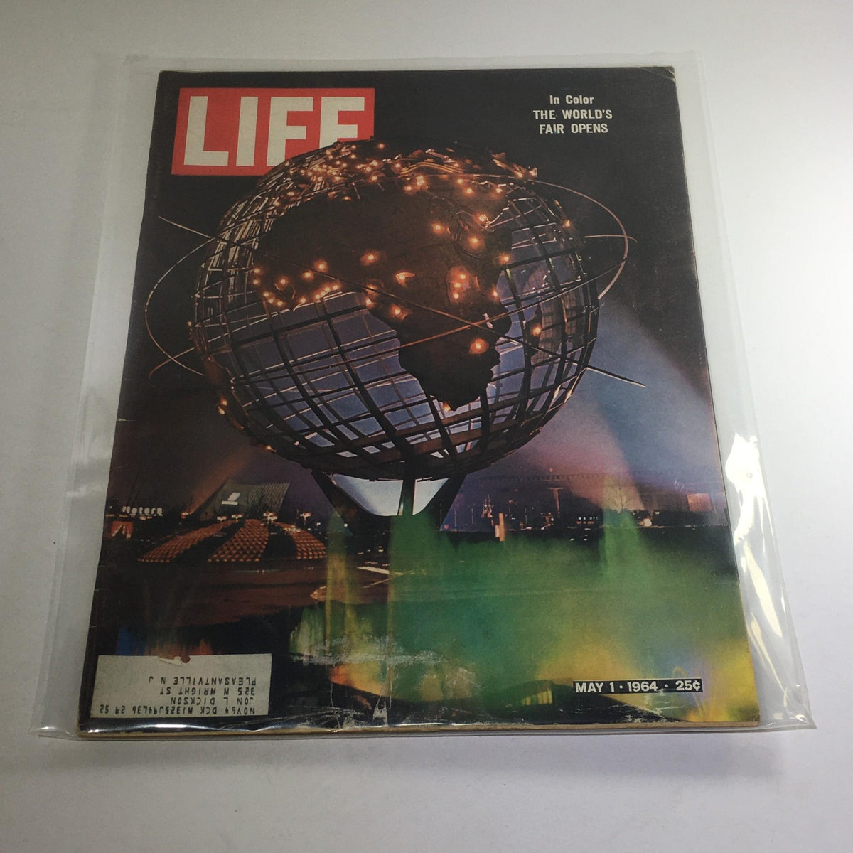 Cover of VTG Life Magazine dated May 1, 1964, featuring the World's Fair opening in New York City, showcasing a globe with lights and vibrant colors.