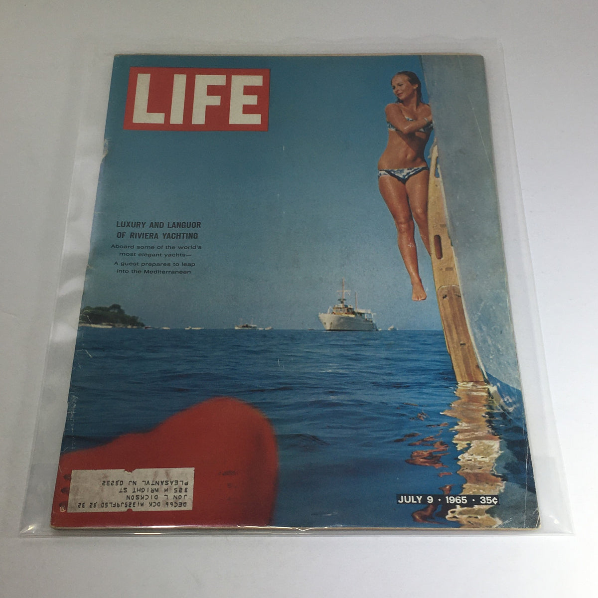 VTG Life Magazine cover from July 9, 1965, featuring the title 'Luxury and Languor of Riviera Yachting', showcasing a young woman in a bikini by the water with yachts in the background, highlighting vintage charm and coastal allure.
