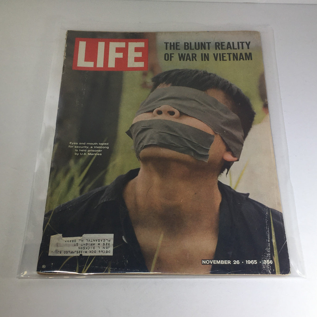 Vintage Life Magazine cover from November 26, 1965 featuring the title 'The Blunt Reality of War in Vietnam', depicting a prisoner with eyes and mouth taped for security.