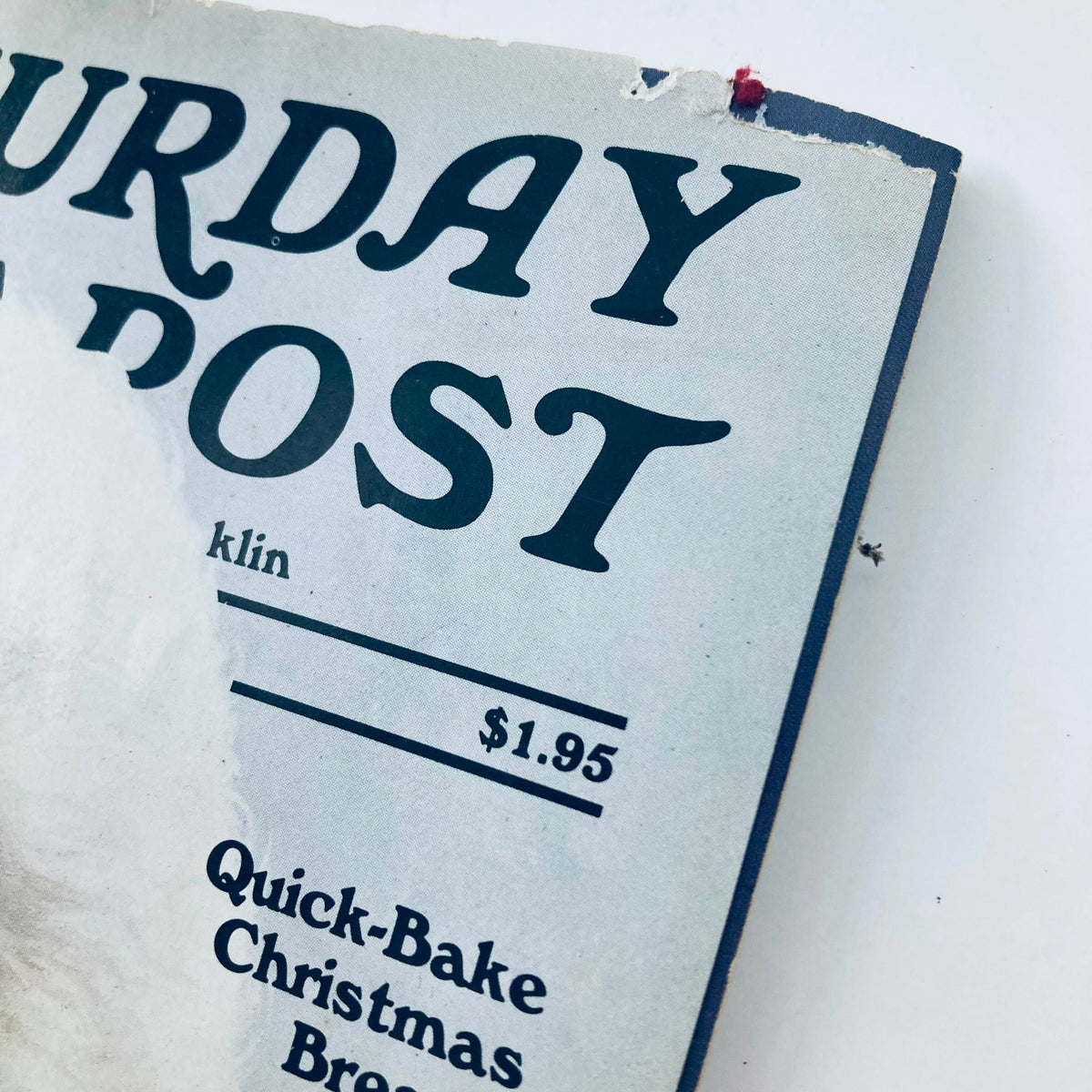 Close-up of the top section of the Saturday Evening Post Magazine December 1988, showcasing the magazine title and price, reflecting vintage magazine design elements.
