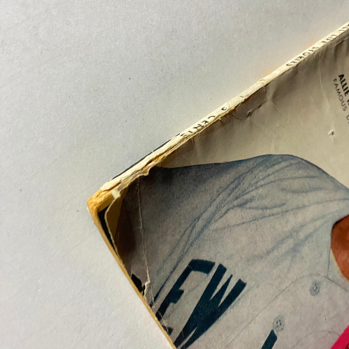 Close-up of the corner of Baseball Life Stories Magazine 1953 Vol 1 No. 2 showing wear and tear, emphasizing its vintage condition.