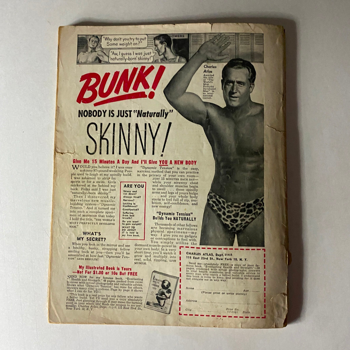 Cover of an advertisement from Complete Baseball Magazine Spring 1951 titled 'BUNK! NOBODY IS JUST "Naturally" SKINNY!' discussing a fitness program with Charles Atlas.