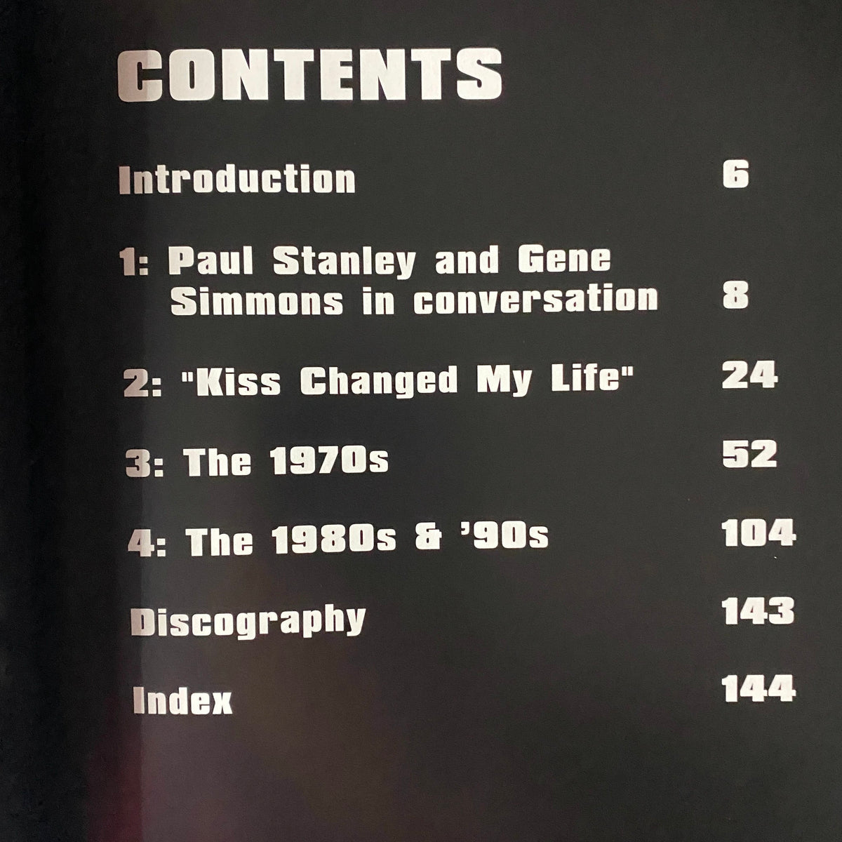 Table of contents page from 2002 KISS: Hotter Than Hell magazine, outlining sections including conversations with Paul Stanley and Gene Simmons, and KISS's impact in the 1970s and beyond.