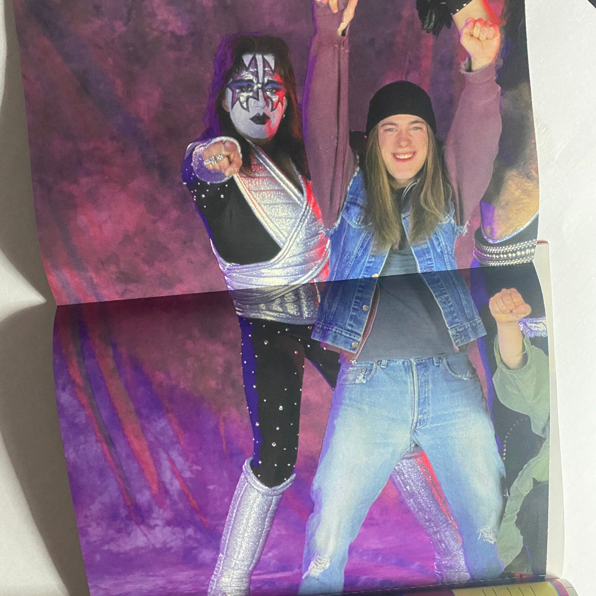 Fold-out poster page from Metal Edge Magazine Summer 1999 showcasing a KISS member posing with a fan, capturing the excitement and spirit of the band.