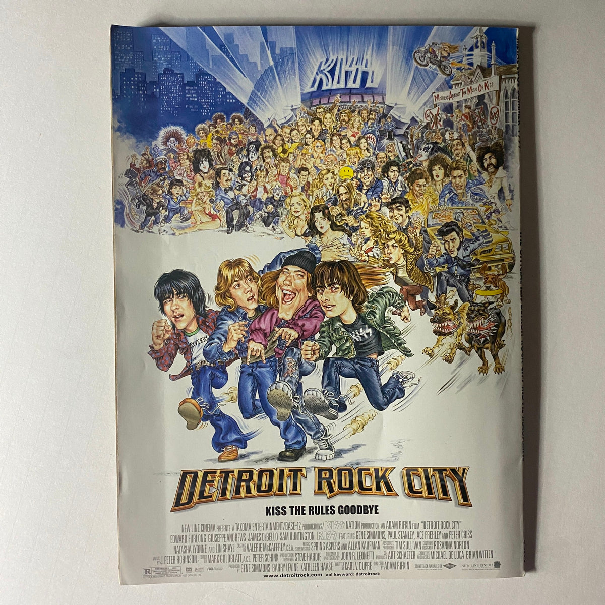 The promotional poster for 'Detroit Rock City', a film featuring the iconic KISS band. The artwork showcases a dynamic scene filled with characters, celebrating the lively rock and roll culture surrounding KISS.