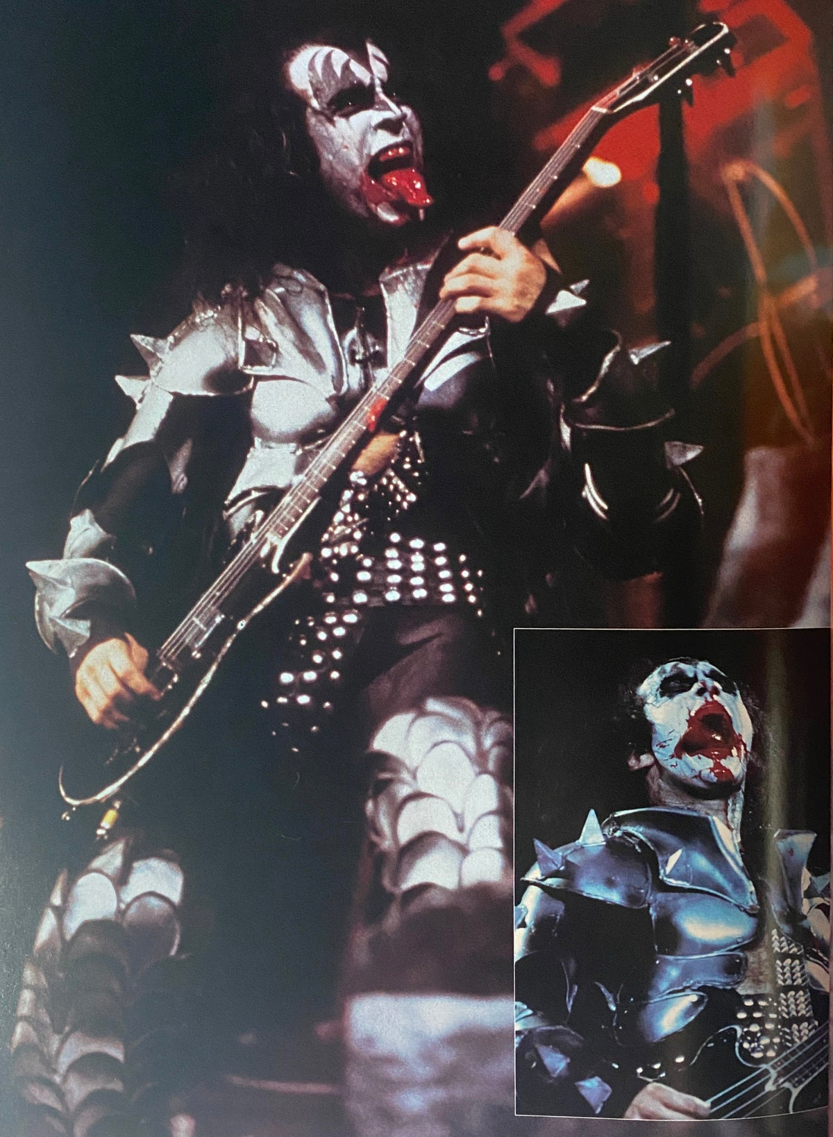 Action shot of a KISS band member from 'The KISS Years' by Barry Levine, wearing a striking armor costume and performing on stage, depicting the band's theatrical rock style.