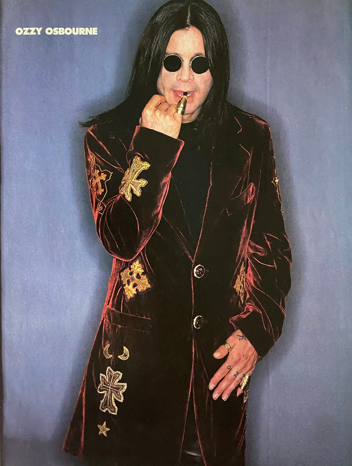 Portrait of Ozzy Osbourne featured in Metal Edge Magazine March 2000, showcasing his iconic look with sunglasses and ornate clothing.