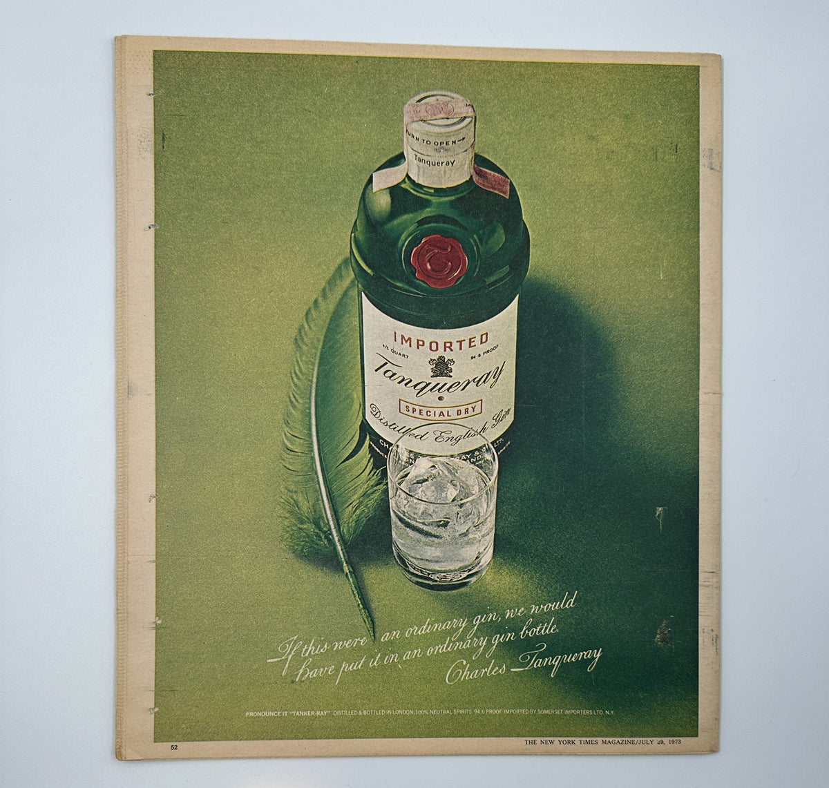 Advertisement in The New York Times Magazine July 29, 1973, featuring a bottle of Tanqueray gin with a tagline, emphasizing the quality of imported spirits.