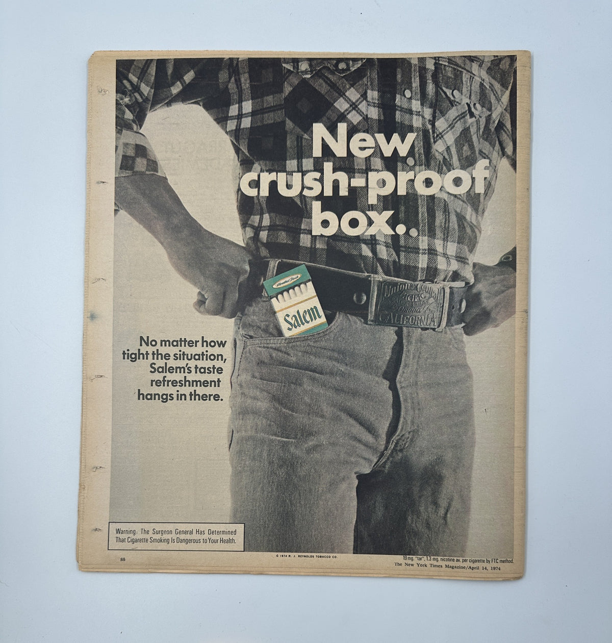 Advertisement in The New York Times Magazine April 14, 1974 for Salem cigarettes, highlighting a 'new crush-proof box' with a focus on product durability.