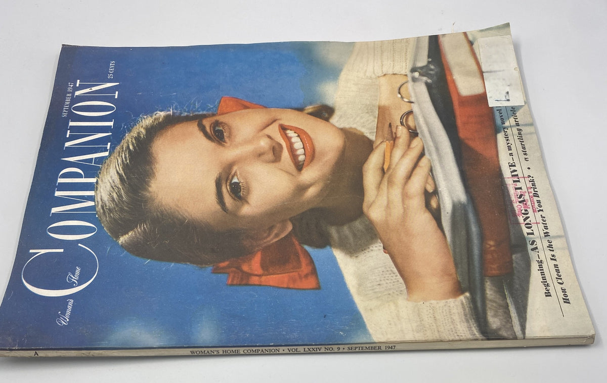 Cover of Woman’s Home Companion Magazine, September 1947, featuring a smiling model with a red bow, highlighting the magazine title 'COMPANION' and showcasing vintage fashion.