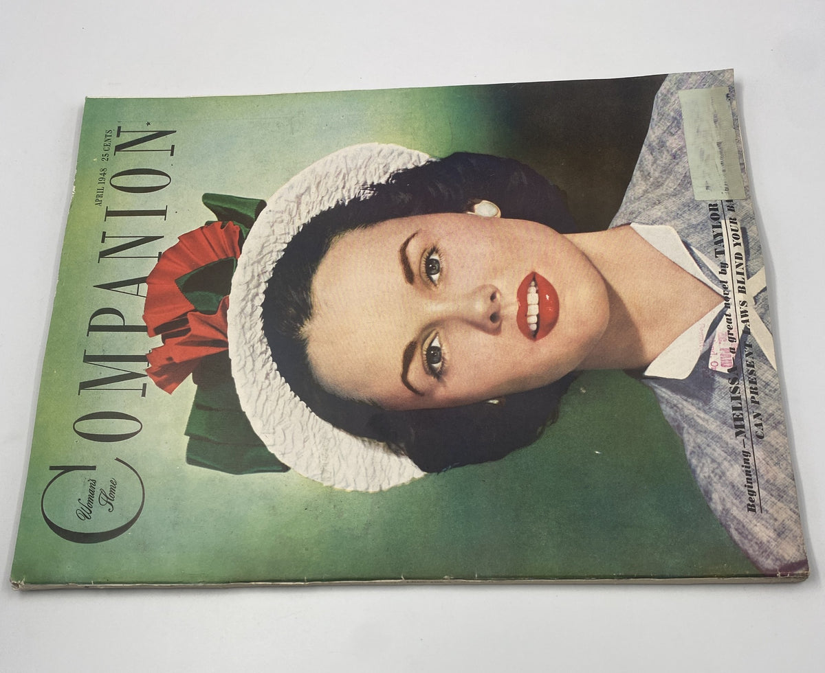 Woman's Home Companion Magazine April 1948 cover highlighting a portrait of a woman with a white flower crown and red accents. The title 'Melissa by Taylor Caldwell' appears prominently on the cover, emphasizing its vintage charm.