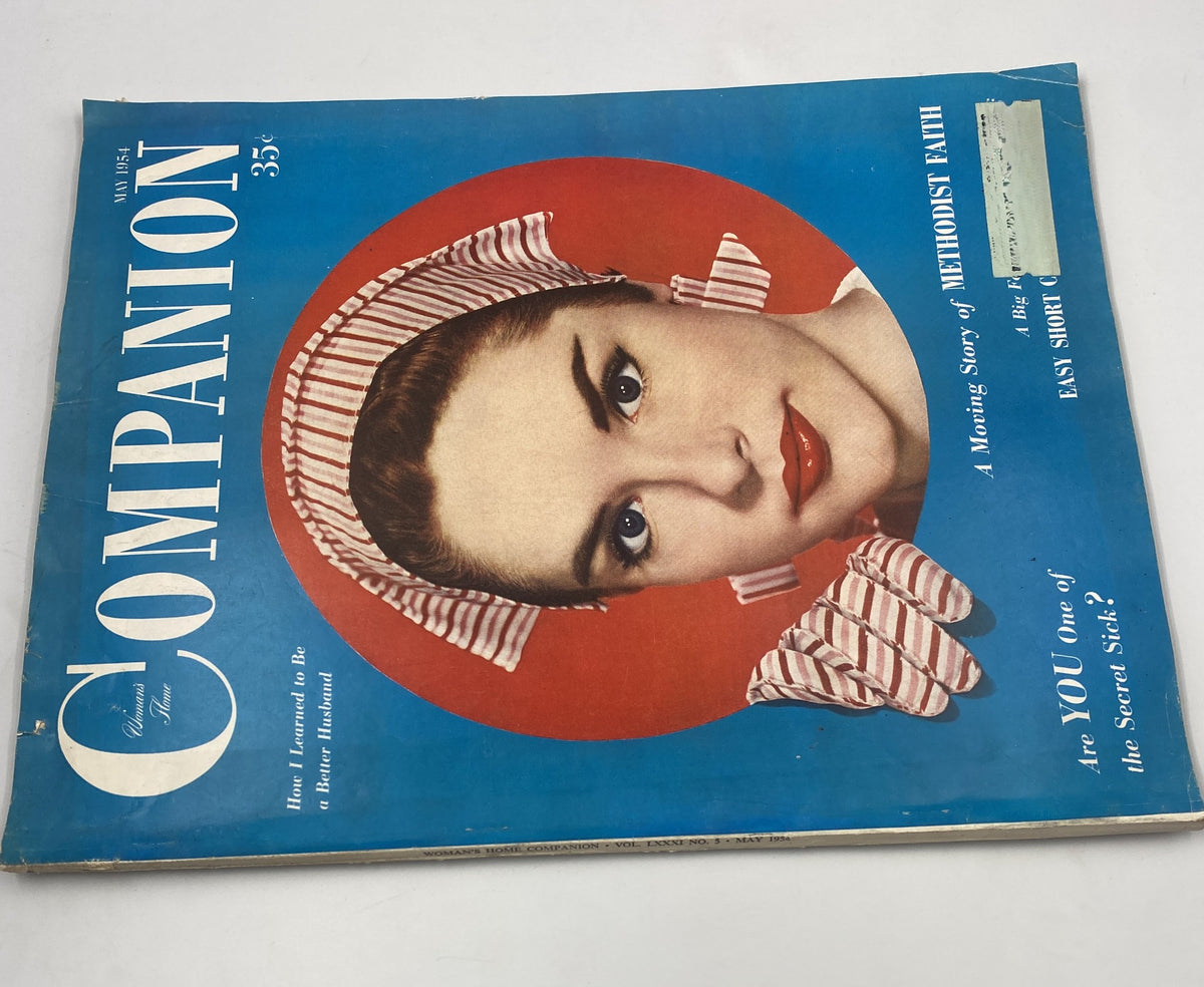 Another view of the Woman’s Home Companion Magazine May 1954 cover showcasing a woman in a striking headscarf, emphasizing the topics of 'Methodist Faith' and tips for becoming a better husband.