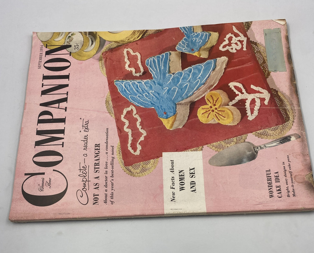 Woman’s Home Companion Magazine September 1954 displaying the cover for 'Not As a Stranger,' highlighting colorful imagery of a blue bird against a floral background, emphasizing content about women and relationships.