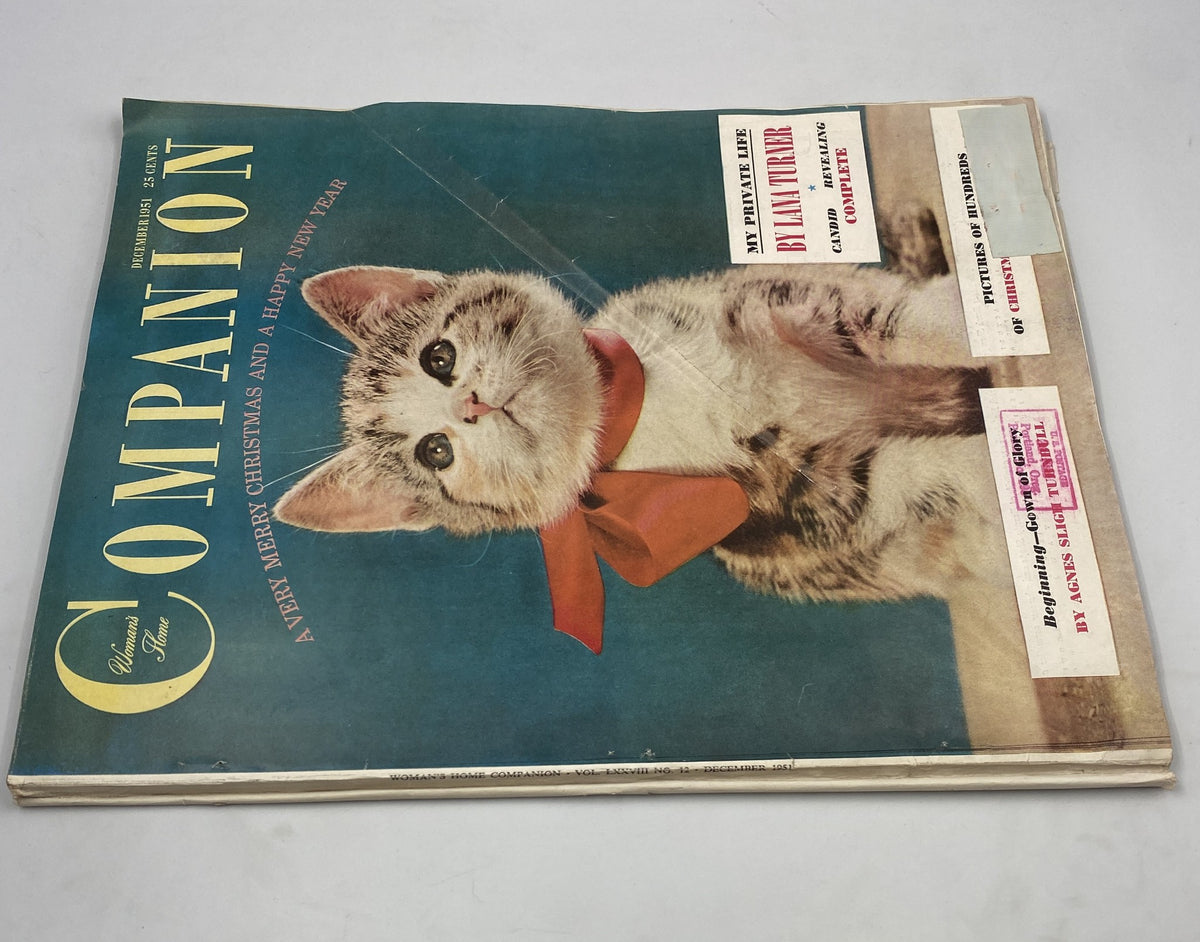Woman’s Home Companion Magazine December 1951 showcasing a cute kitten on the cover, decorated with a red ribbon, and the title emphasizing Merry Christmas and Happy New Year.
